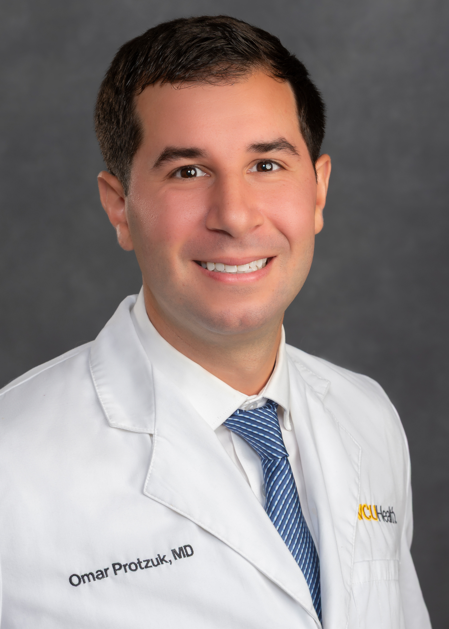 Omar Protzuk, M.D.